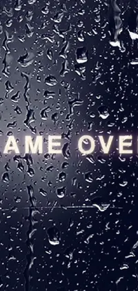 This phone live wallpaper features a minimalistic yet impactful design of a rain-covered window with the words "Game Over"