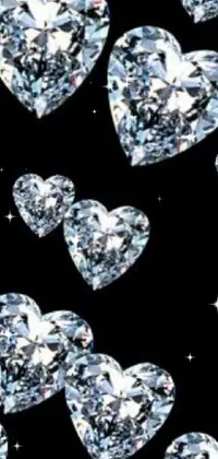 This mobile live wallpaper boasts an exquisite design of numerous diamonds set against a black backdrop, perfectly accented by red and pink hearts