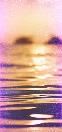 This phone live wallpaper features a stunning representation of the sun shining over water