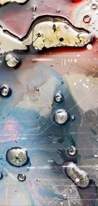 This live wallpaper depicts water droplets on a surface, with inspiration from abstract art and silver and muted colors