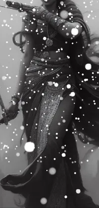 This live wallpaper features a black and white photo of a strong woman with a sword, set in a fantastical world