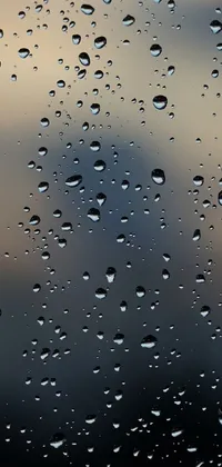 Transform your phone screen with a stunning live wallpaper of water droplets on a window