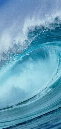 This live wallpaper depicts a stunning image of a surfer riding a massive wave on a surfboard, immersed in blue water