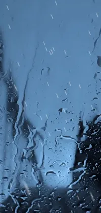 Experience the beauty of rainfall with this stunning new live wallpaper for your phone