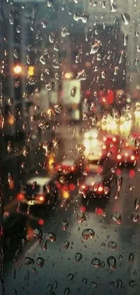 This phone live wallpaper sets a rainy cityscape view as seen through a window as the perfect backdrop