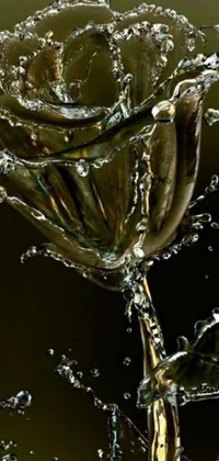 Transform your phone's screen with this captivating live wallpaper featuring a close-up of a stunning water droplet flower