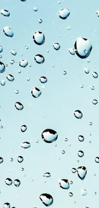 This phone live wallpaper presents a stunning digital art featuring a close-up view of water droplets on a window with a bright blue sky in the background