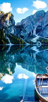 This stunning live wallpaper for your phone features two boats resting on a serene lake in Italy