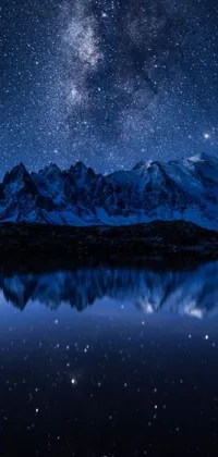 This phone wallpaper is a stunning matte painting, featuring a large body of water surrounded by snow-capped mountains