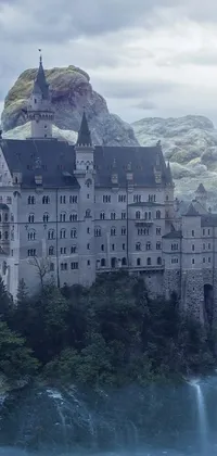 This phone live wallpaper is a breathtaking matte painting with a castle on top of a mountain situated near a waterfall in Germany