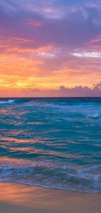 This stunning live wallpaper features a beautiful beach scene with a large body of water, sandy beach, and vibrant sunrise colors of orange, turquoise, and purple