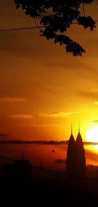 This live wallpaper features a stunning clock tower against a picturesque sunset backdrop