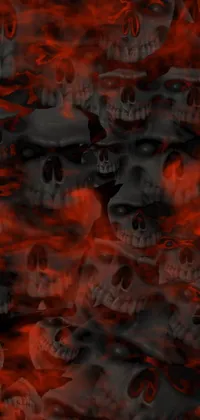 This live wallpaper boasts a daring design with a row of skulls displayed against a fiery texture