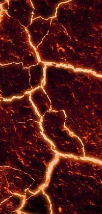 Experience a fiery and dynamic live wallpaper with a dramatic close-up of an intricate crack in the ground