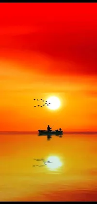 This beautiful phone live wallpaper showcases a serene scene of a boat gently drifting on water at sunset, surrounded by birds and a red sky with a few clouds