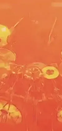 This live wallpaper for your phone boasts an array of oranges sitting atop a table mixed with video art, a red liquid drip effect, many cymbals, an Instagram logo, and a webcam screenshot, all adorned with emoji hearts, flames, mushrooms, and tornadoes