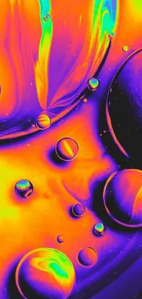 This phone live wallpaper features water droplets, psychedelic art, planets, high contrast coloring, and futuristic elements