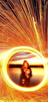 This live wallpaper features a stunning image of a person amidst a circle of electric sparks
