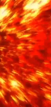 This live wallpaper features a close-up view of a fiery explosion in red and yellow tones