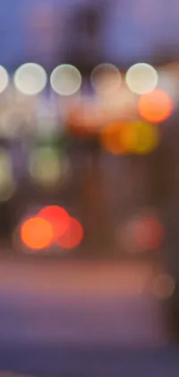 This live wallpaper depicts a red fire hydrant on a blurred urban background with orange streetlights and tiny points of light