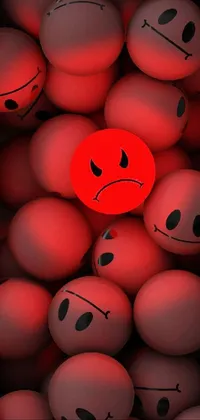 This phone live wallpaper features a sad red ball amidst a pile of red balls