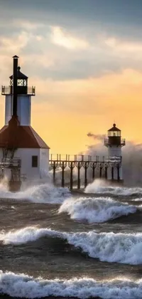 This phone live wallpaper captures the serene beauty of a lighthouse at sunset or dawn