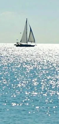 This stunning live wallpaper features a sailboat sailing across the ocean on a bright, sunny day under a blue sky with white clouds