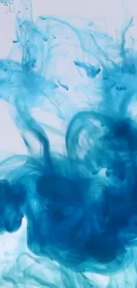 This phone live wallpaper boasts a stunning close-up of a blue substance in water, an airbrush painting, YouTube video screenshot, inkblots of color, or a still from a music video