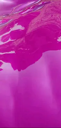 This mobile live wallpaper showcases a hyperrealistic close-up of a car's paint hood with varying shades of pink