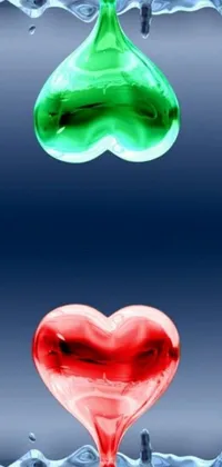 This phone live wallpaper depicts two vibrant hearts, one green and one red, side by side