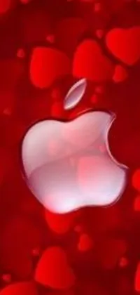 Get this stunning live wallpaper for your phone featuring the iconic apple logo surrounded by heart designs on a vibrant red background