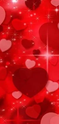 This live wallpaper for your phone features an array of hearts in digital art format against a bold red background with dazzling stars set to make your phone screen beautiful