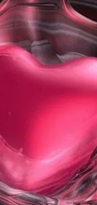 This live wallpaper features a pink heart floating in a bowl of water