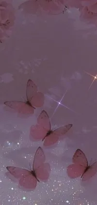Looking for a stunning phone live wallpaper to jazz up your device? Check out this celestial-inspired design, featuring a group of pink butterflies resting on a bed of lush greenery and flowers