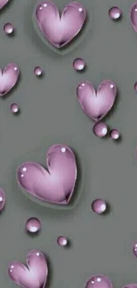 Brighten up your phone's homescreen with this captivating live wallpaper featuring a variety of pink love hearts set against a cool gray background