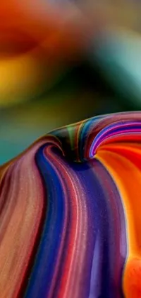 Looking for a stunning phone live wallpaper that showcases a colorful object close up? This option, inspired by Morris Louis Bernstein and featuring a swirling, mesmerizing scene, is sure to suit your needs