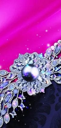 This phone live wallpaper features a highly-detailed brooch with gold detailing and a large sapphire on a gradient pink background