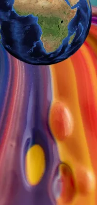 Get lost in this colorful and mesmerizing phone live wallpaper featuring a cake decorated with a picture of planet earth