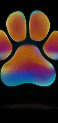 This phone live wallpaper features a close-up of a dog's paw print on a black background