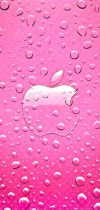This eye-catching phone live wallpaper features a close-up of water droplets on an Apple logo set against a pop art-inspired pink and purple background