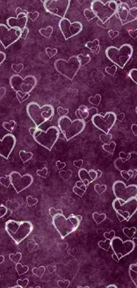 This phone live wallpaper features a mesmerizing pattern of hearts set against a purple background