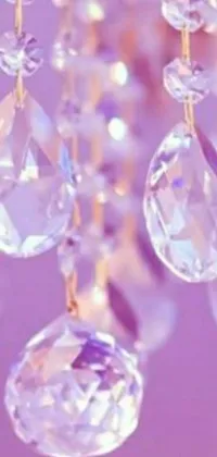 This phone live wallpaper depicts a stunning chandelier embellished with mesmerizing crystal beads that sway gently on a Tumblr-inspired pastel purple background