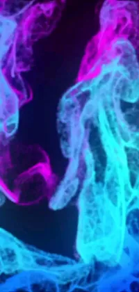 Get a stunning phone live wallpaper featuring a dynamic close-up image of a cell phone with colorful smoke swirling out of it, microscopically captured for a unique effect