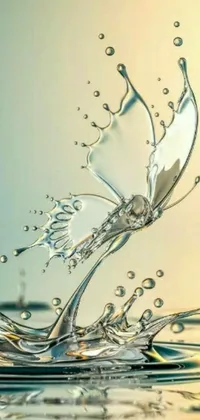 This phone live wallpaper features a striking digital art image depicting a splash of water on a serene body of water