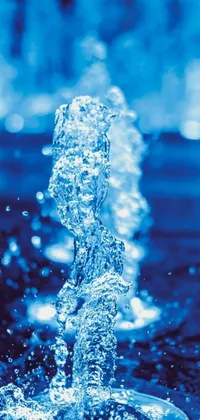 This phone live wallpaper showcases a stunning close-up of a water fountain with blue lights