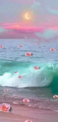 This phone live wallpaper features a group of diverse sea shells atop a sandy beach with gentle waves