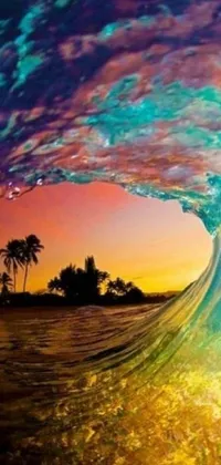 This lively phone wallpaper showcases a skilled surfer riding a wave on their surfboard against the backdrop of colorful sunset hues
