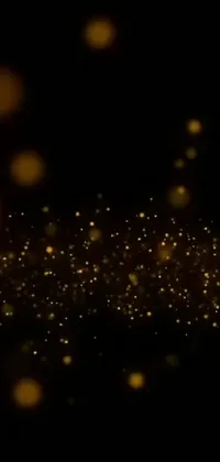 Looking for a striking and dynamic live wallpaper for your phone? Look no further than this brilliant and mesmerizing animation, which features a dark black background adorned with sparkling gold lights, bubbles, and fairy dust