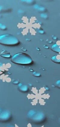 The phone live wallpaper displays water droplets on a surface