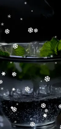 This live wallpaper features a glass of water on a wooden table with steam rising from it